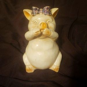 Laughing pig figurine